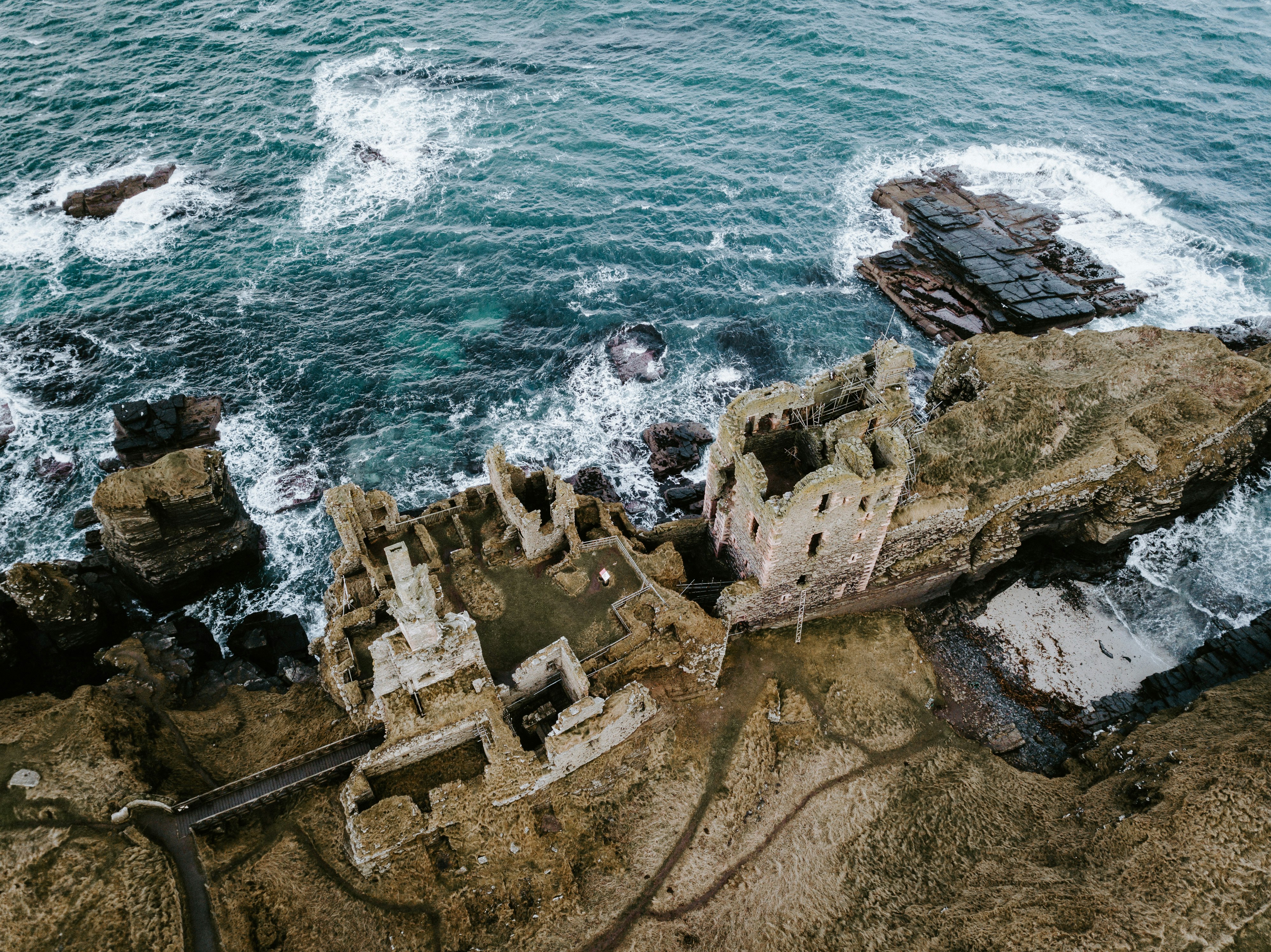 aerial photography of castle near body of water